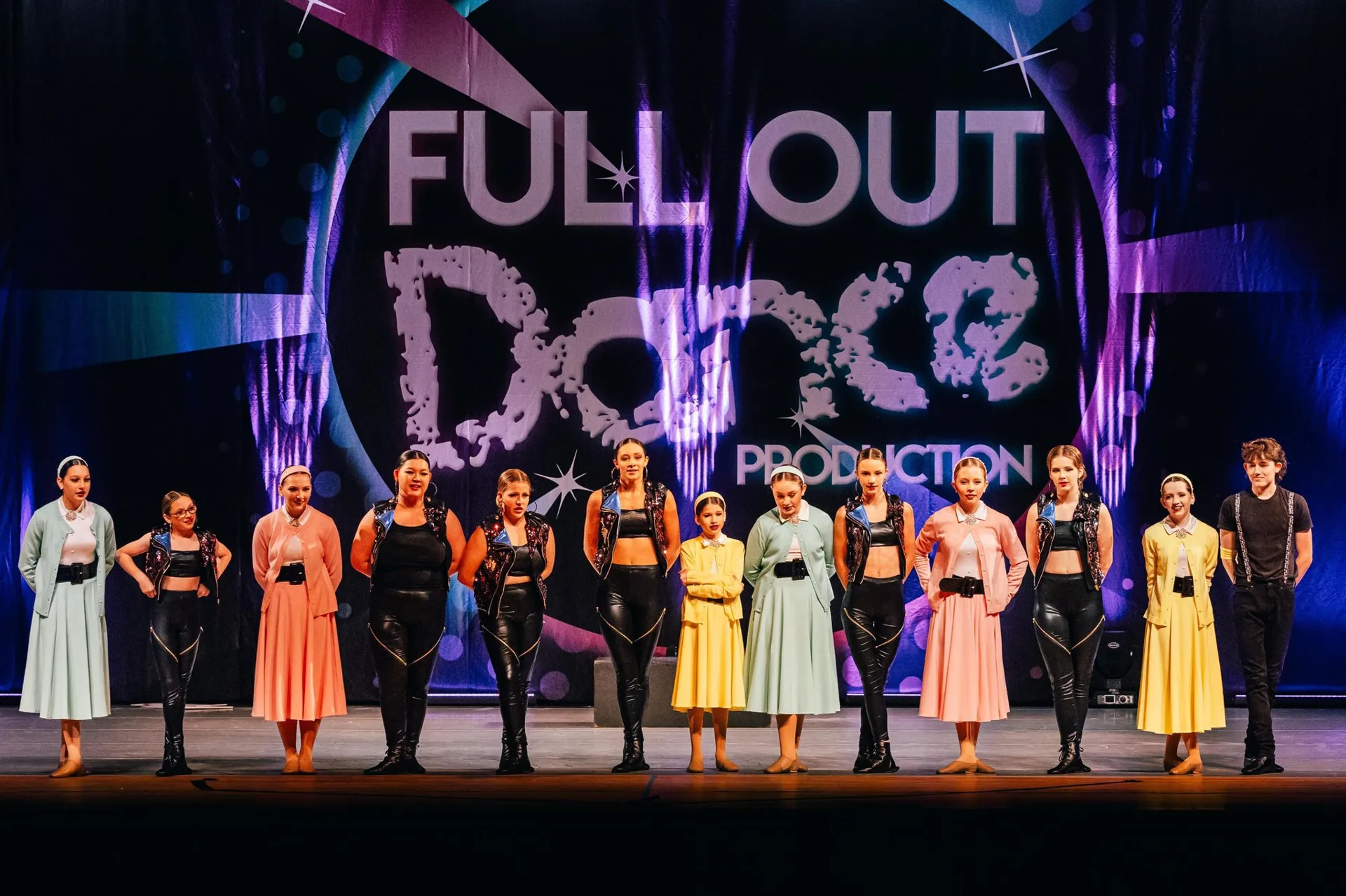 Full Out Dance Production dancers performing on stage